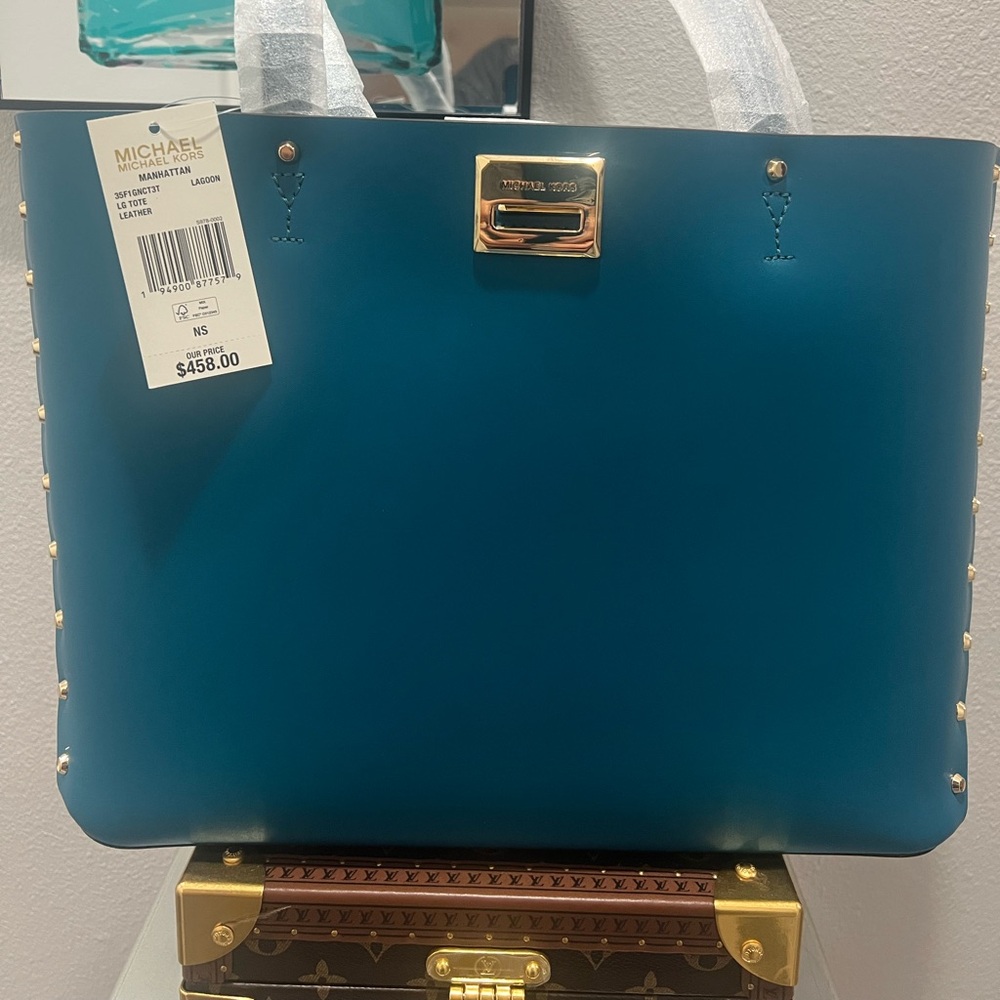 Michael Kors Manhattan Lagoon Blue Leather Handbag with Gold Accents.